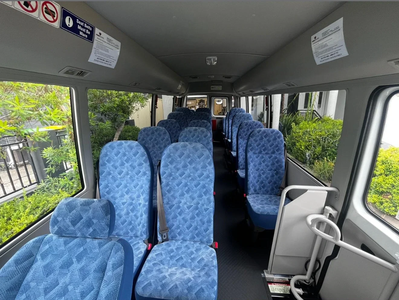 The aisle and seating inside a minibus
